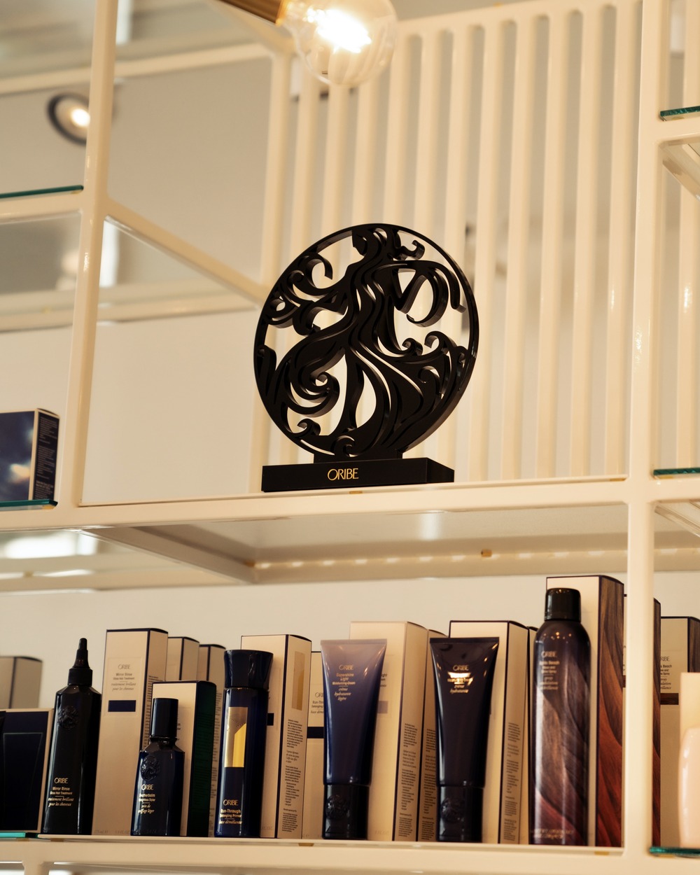 The Oribe medallion on the retail shelf