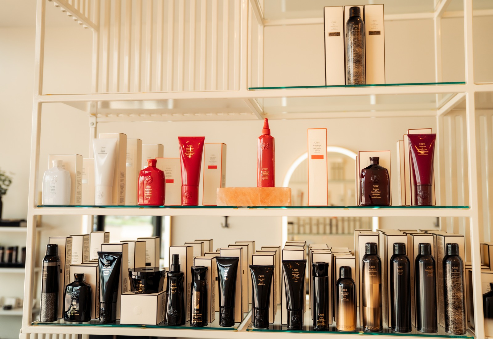 The Oribe retail shelf at Rise Above Beauty Lounge